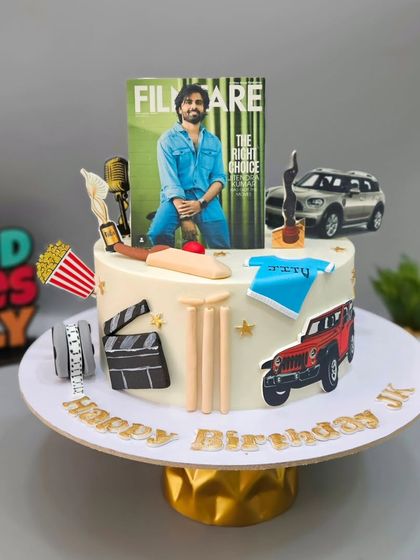 Another shot of the "Jitu Bhaiya" cake, showcasing the edible prints of his favorite cars and a "Jitu" t-shirt.