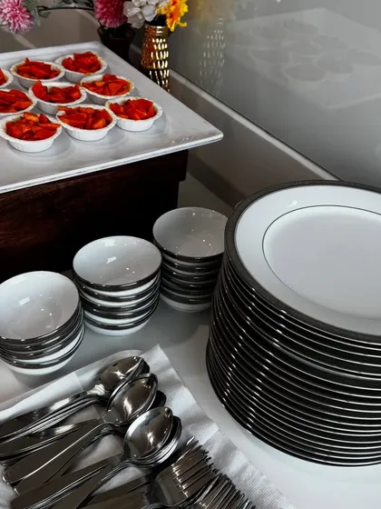 Part of our full-service catering includes providing all necessary crockery and cutlery. Here is a neat arrangement of plates, bowls, and silverware for a boardroom lunch.