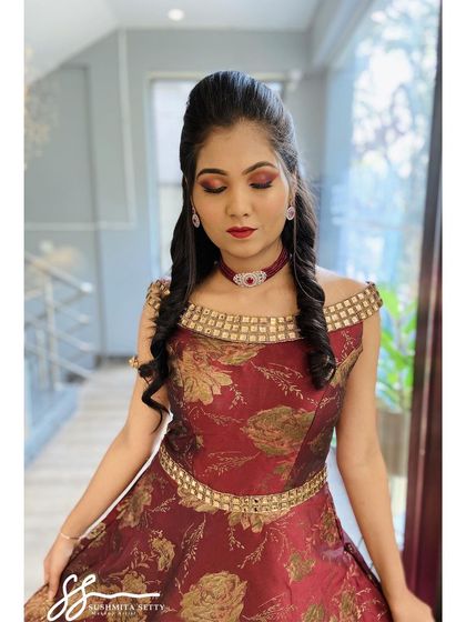 The complete look for a Sangeet or reception party. The makeup, hair, and outfit come together to create a truly show-stopping effect.