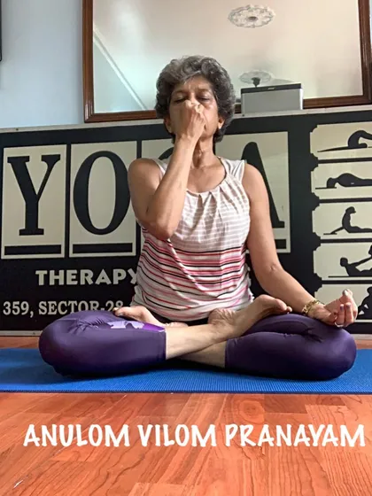 I am demonstrating Anulom Vilom Pranayam, a key breathing technique we practice. This alternate nostril breathing is excellent for calming an anxious mind, balancing your energy, and improving sleep during pregnancy.