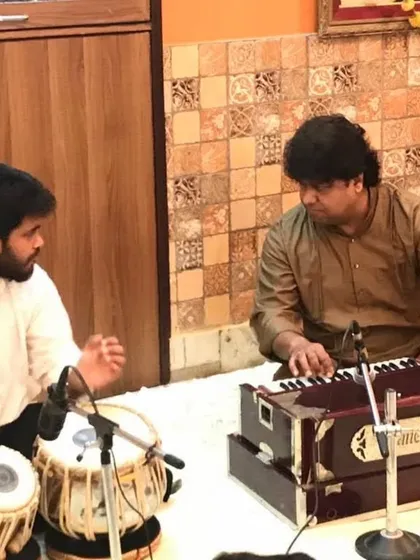 I am here today because of the blessings and teachings of my Guruji, Pandit Subhankar Banerjee ji. This photo captures a moment of learning from him, a memory I cherish. Every lesson I teach is a tribute to his guidance.