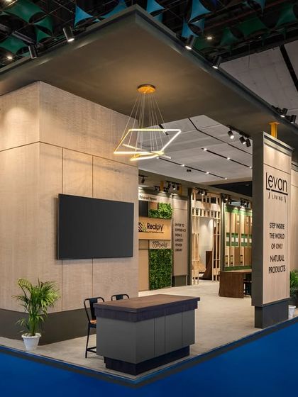 This corner view of the Realply stall shows the powerful composition of solid masses and open entryways. The design uses a simple yet bold geometric language to define the 240 sq.m space.