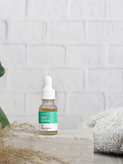 A slightly different perspective of the Dermatouch serum, shot at eye-level to give the product a strong, stable presence.