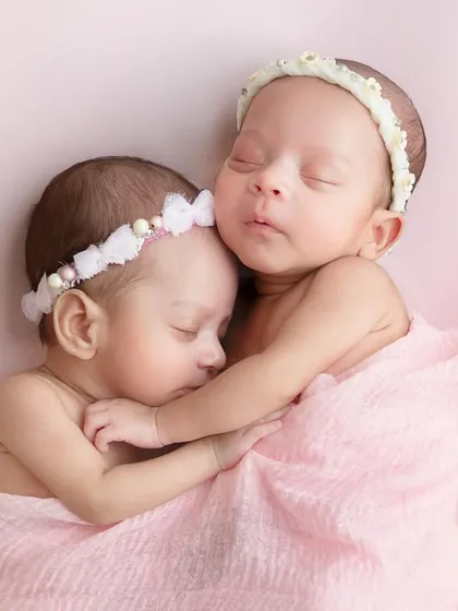 Capturing twins is double the joy and double the challenge, a specialty I absolutely adore. These two sweet girls, sharing a cuddle just as they shared the womb, create a picture that truly speaks for itself.