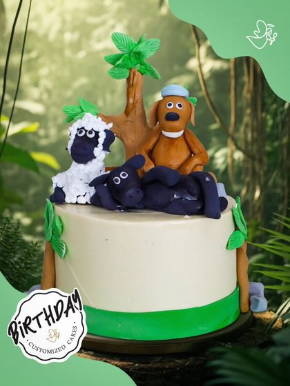 A charming "Shaun the Sheep" cake featuring the whole flock. This fun design brings the playful farmyard antics to life with detailed fondant characters.