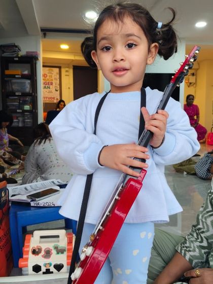 A confident pose from one of our future performers during a fun, music-filled activity.