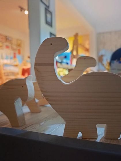 Our wooden animal figures stand ready for their colorful transformation. These are a key part of our DIY kits that encourage imaginative play and artistic expression.