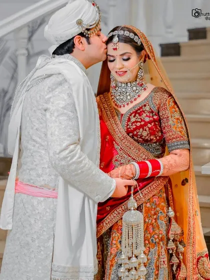 A gentle kiss on the forehead. This tender and romantic portrait of the newlyweds is a perfect example of the quiet, emotional moments we love to capture.