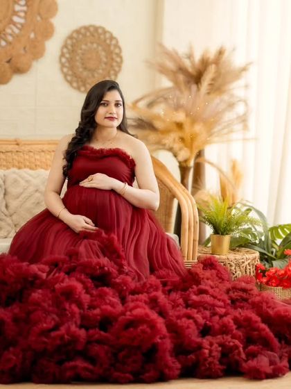 A slightly different angle of the seated portrait, capturing the mom-to-be's happy and serene expression.