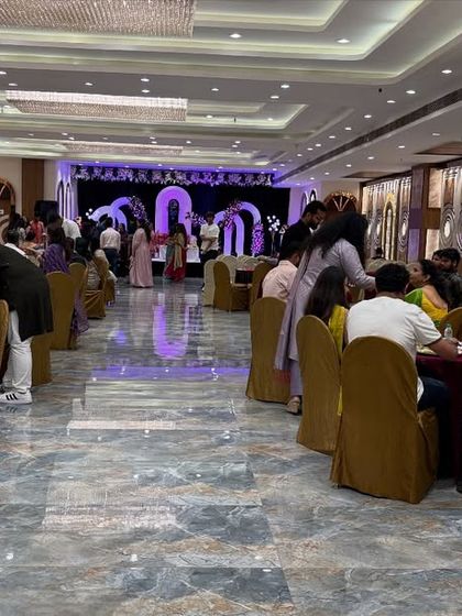 Guests enjoying their meal in the dining section of Sky Banquet, Kharghar. The spacious layout ensures there is no crowding around the buffet counters.