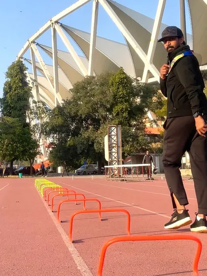 A moment of focus before a hurdle drill session. The track is our canvas, and equipment like these hurdles are the tools we use to paint a picture of speed and agility.