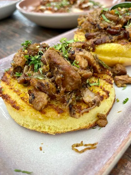 Our zesty Chilly Pork served on a buttery brioche bun. This dish balances spice and rich fatty pork, making it the perfect snack to pair with a pint of beer or your favorite drink.