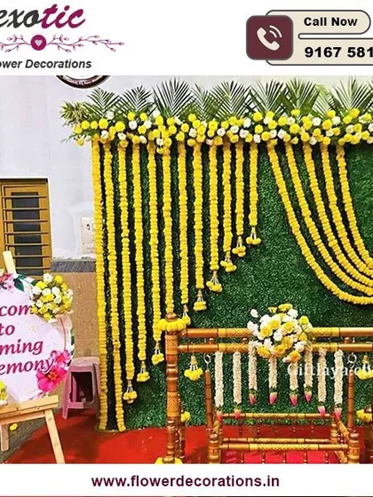 A beautiful setup for a baby's naming ceremony. We created a backdrop of marigold garlands against a green wall, with a traditionally decorated cradle, or 'palna', ready for the baby.
