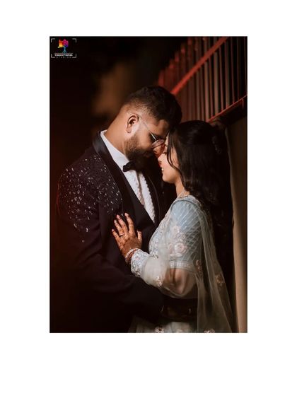 An intimate and close-up reception portrait. This photo focuses on the tender connection between the couple, capturing a quiet moment amidst the celebration.