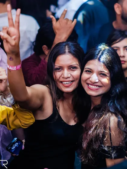 Friends enjoying the party together.