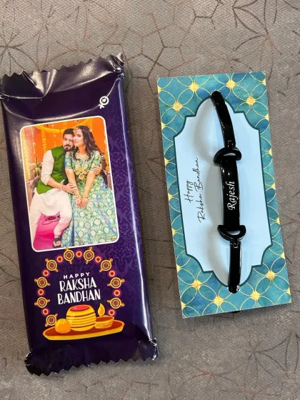 The Rakhi Combo 3.0 shown with the black name bracelet option.