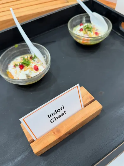 A serving of our delicious Indori Chaat, garnished with pomegranate seeds and fresh coriander. We present our chaat in individual bowls for easy enjoyment at parties and corporate meets.
