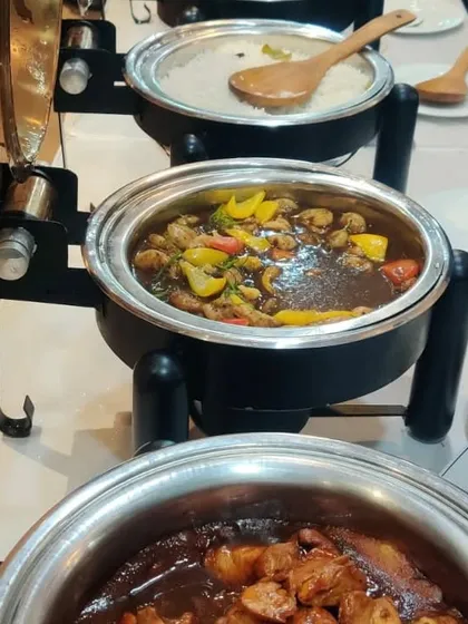 Hot dishes ready to be served in our professional buffet warmers. Whether it's a black bean chicken or a Thai curry, we ensure your office lunch is hot, fresh, and delicious.