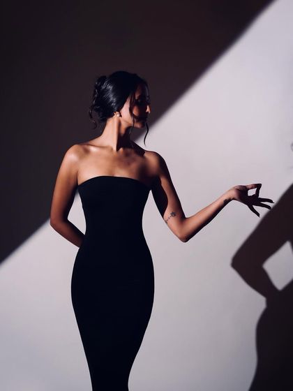 A silhouette of a hand mudra against the light. This artistic photo highlights the intricate details and storytelling power of classical dance gestures.