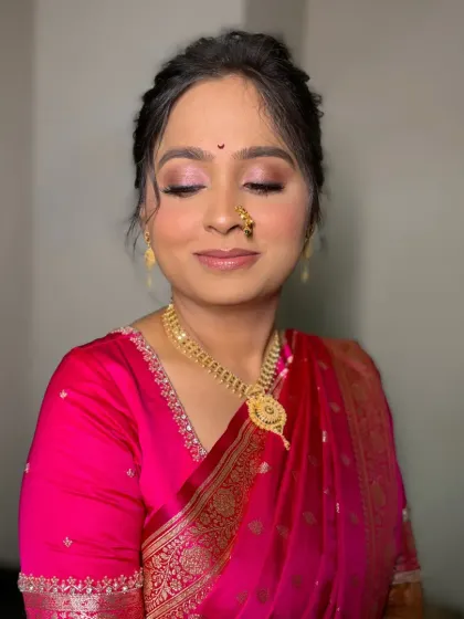 A close-up of the eye makeup for this engagement look. The soft, shimmery pink tones make her eyes pop while keeping the overall look elegant.
