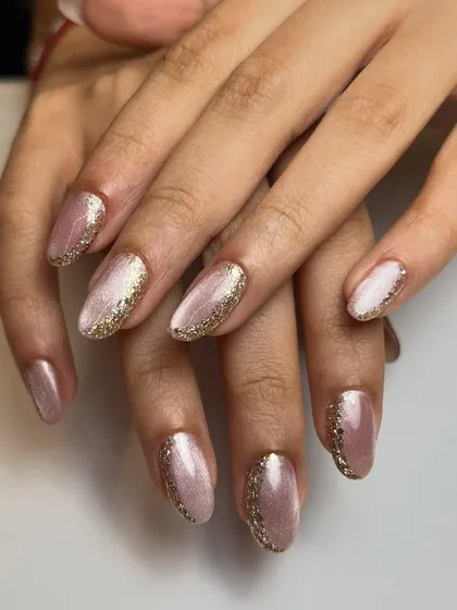 The full view of the minimal glittery nails, a very elegant and sophisticated way to incorporate sparkle into your manicure.