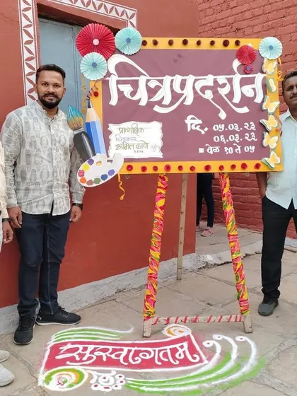 Standing with the faculty of the Latur art college at the entrance of their annual exhibition.