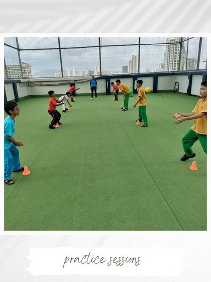 A focused practice session on our turf. Players are seen working on their catching and fielding skills under the guidance of our coaches, highlighting our commitment to all-round development.
