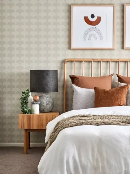 From our project in NSW, Australia, this cozy and contemporary bedroom design showcases a perfect balance of textures, earthy tones, and modern aesthetics. The use of rich rust and terracotta hues adds warmth, while geometric designs emphasize simplicity.