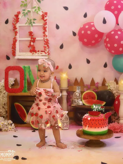 Getting delightfully messy with her watermelon cake! These are the moments I love to capture during a first birthday cake smash photoshoot.