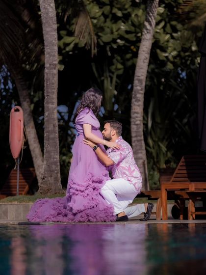 Capturing a tender moment by the pool. The rich color of the lavender gown stands out against the tropical background of their resort location in Sri Lanka.