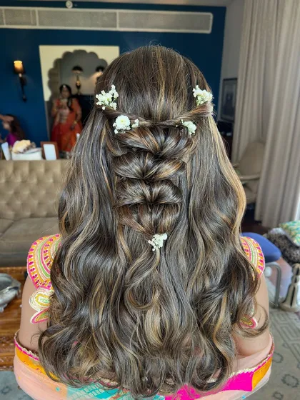 A perfect example of a romantic and complex half-up style that is still soft and wearable.