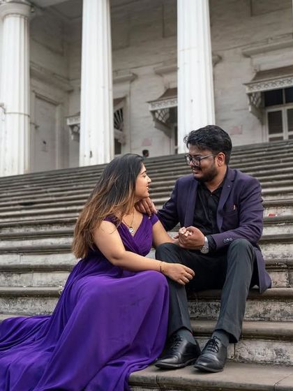 A royal purple gown for a love that feels like royalty. The long, flowing trail of this dress looks magnificent cascading down the steps for a dramatic pre-wedding picture.