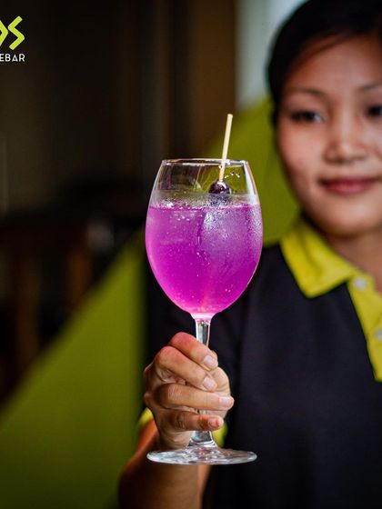 A signature cocktail served with a smile. Our team is ready to mix up your favorite drink.