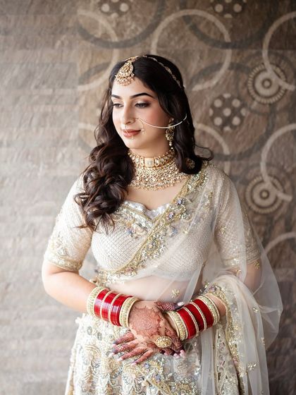 A detailed shot of the soft glam makeup for this Sikh bride. The look features defined eyes and a neutral lip, allowing her natural beauty and stunning outfit to take center stage.