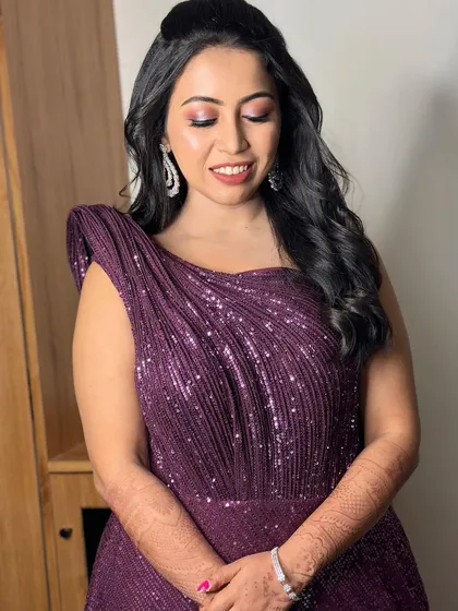 A close-up of the bride's happy expression. The makeup is designed to be vibrant and fun, perfect for a cocktail party.
