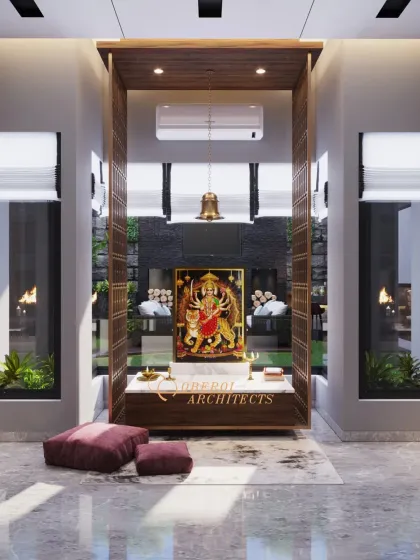 A modern pooja space designed with a clean, open structure. The central altar is framed by wood and set against a backdrop that opens to the outdoors, blending spirituality with nature.