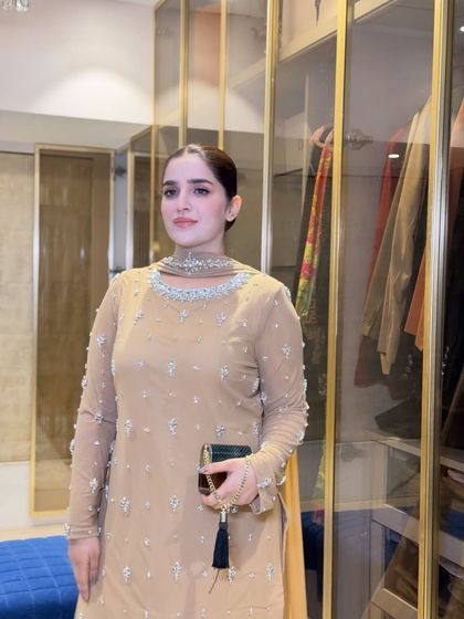 A full-length shot of Shaista ready for the Qawali night. Her simple yet elegant beige outfit is perfectly styled with a sleek bun and my signature soft glam makeup.
