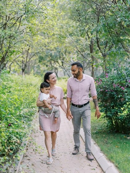 A family stroll through the park. The time before a baby starts walking is perfect for these cuddly, connected shots.