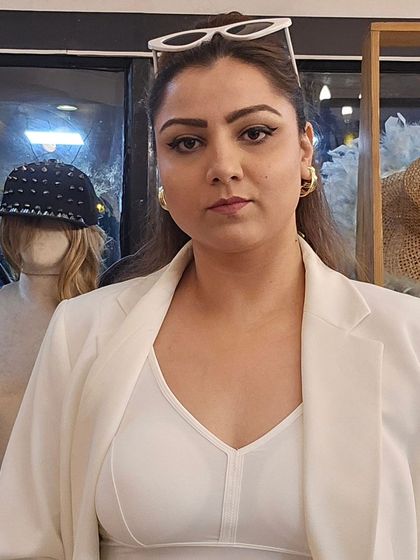 A confident pose in my all-white power outfit, topped off with white sunglasses and our chunky gold hoop earrings. This look is all about owning your style.