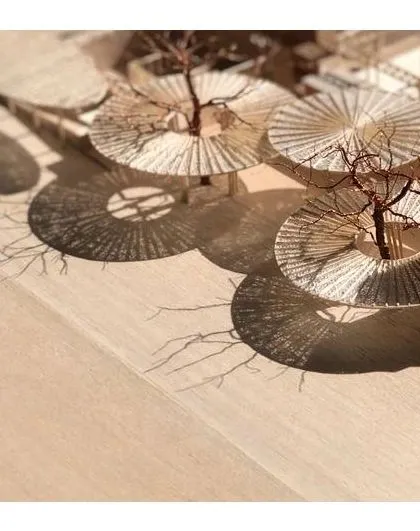 A detailed physical model of The Atelier's canopy system, demonstrating our hands-on approach to design. We study the intricate patterns of light and shadow, known as a moiré effect, to ensure our architectural elements create the intended atmosphere and visual poetry.