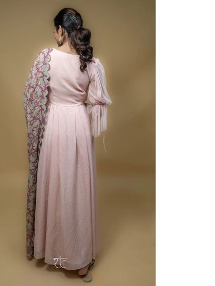 The full view from the back, showcasing the drape of the dress and the contrasting print of the elegant dupatta.