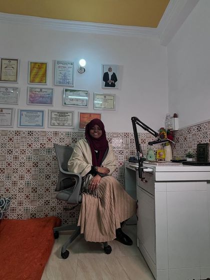 At my desk in Heena's Studio, where I conduct my online classes. This is my happy place, where I connect with students from all over the world.