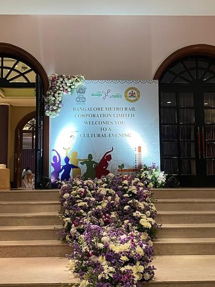 The grand entrance to the cultural evening, decorated with beautiful floral arrangements on the steps. We create welcoming and photogenic entry points for corporate and government galas.