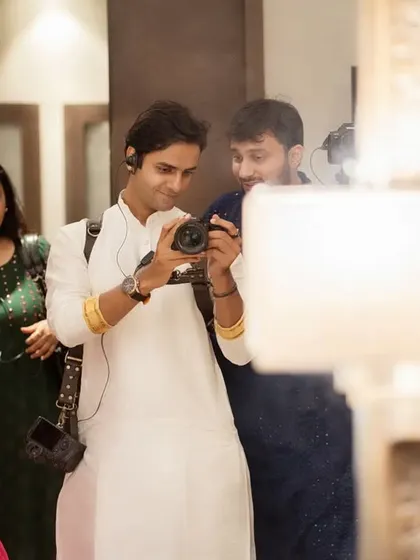 Here I am behind the camera, sharing a just-captured moment with the groom. I believe in a collaborative and friendly approach, ensuring you are part of the creative process and comfortable throughout the day.