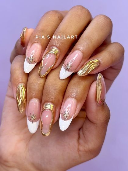 Another look at this high-demand design, showing the combination of a sharp white French tip with bold, 3D gold chrome accents.