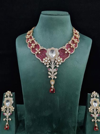 The same elegant bridal necklace, here in a rich ruby red. This color variation offers a more traditional and bold option for a wedding or festive occasion.