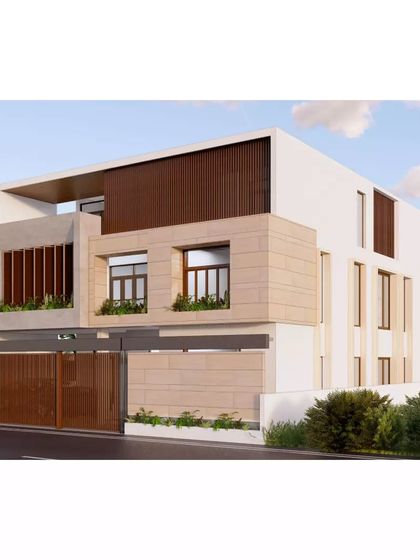 The outdoor spaces of this villa are designed to be a private sanctuary. The facade uses a combination of smooth plaster, textured stone, and wooden louvers to create a warm and inviting modern home.