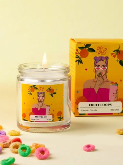 This "Fruit Loops" candle is styled with a scattering of the colorful cereal itself. The bright, cheerful setup perfectly matches the fun and fruity scent of the candle.