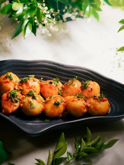 My Honey Tamarind Potatoes with a garlic leaves tadka. The sweetness of the honey and the tang of the tamarind create a truly addictive flavor profile.