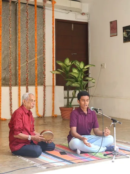 A young vocalist performs with his guru during the "Platform Performances" showcase, embodying the Guru-Shishya tradition.